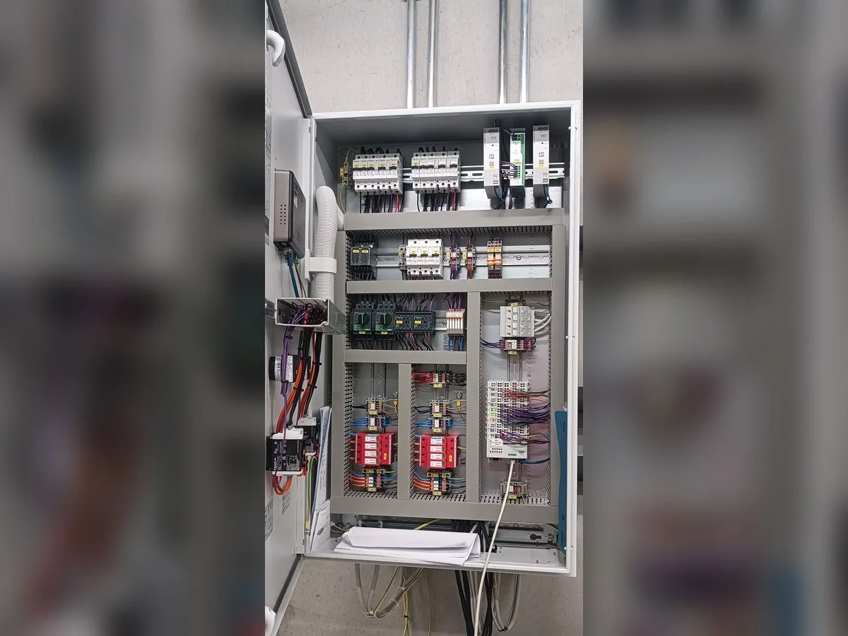 Field commissioning work at an industrial control cabinet